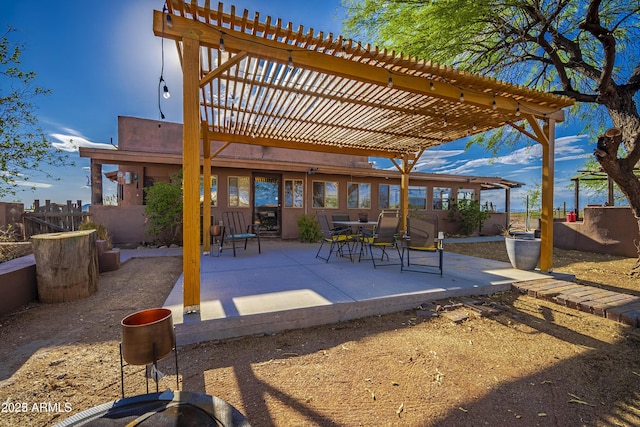 view of patio with fence and a pergola