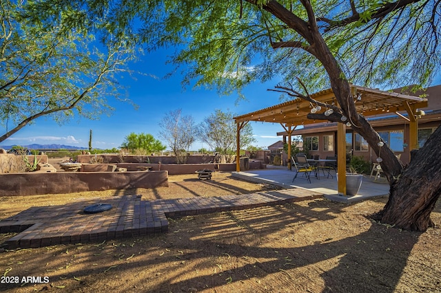 view of yard featuring fence, a gazebo, and a patio area