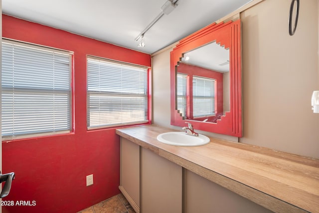 bathroom with tile patterned flooring and vanity