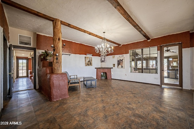 living room featuring a notable chandelier, visible vents, and vaulted ceiling with beams