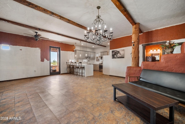 living area featuring beam ceiling and ceiling fan with notable chandelier