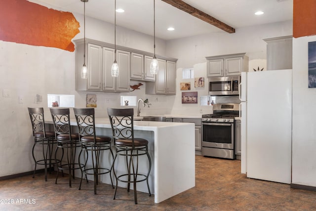 kitchen featuring a kitchen breakfast bar, appliances with stainless steel finishes, beam ceiling, a peninsula, and gray cabinets