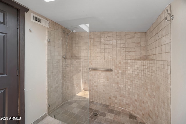 full bathroom with visible vents and a shower stall