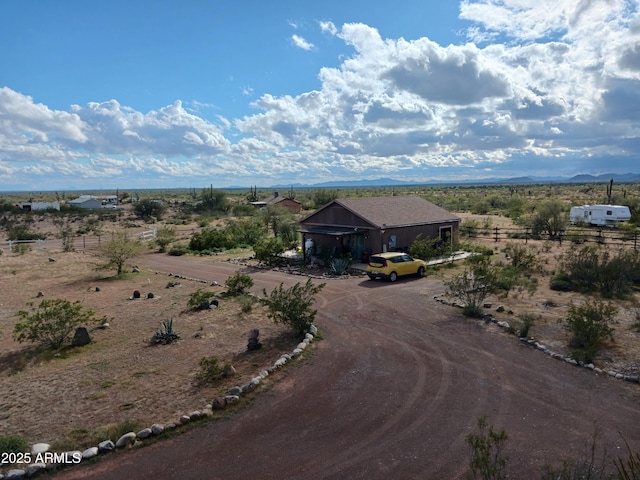 birds eye view of property featuring a mountain view and a rural view