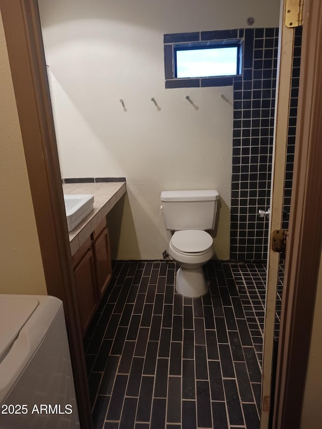 bathroom with toilet and vanity