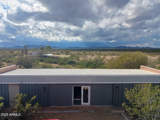 view of front of home featuring a mountain view