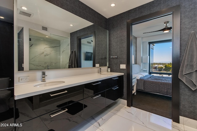 bathroom featuring walk in shower, vanity, and ceiling fan