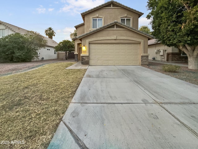 front facade featuring a front yard and a garage