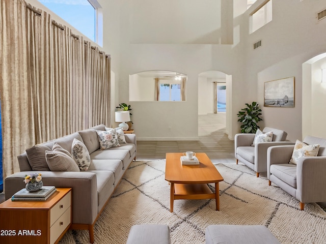 living room with a towering ceiling