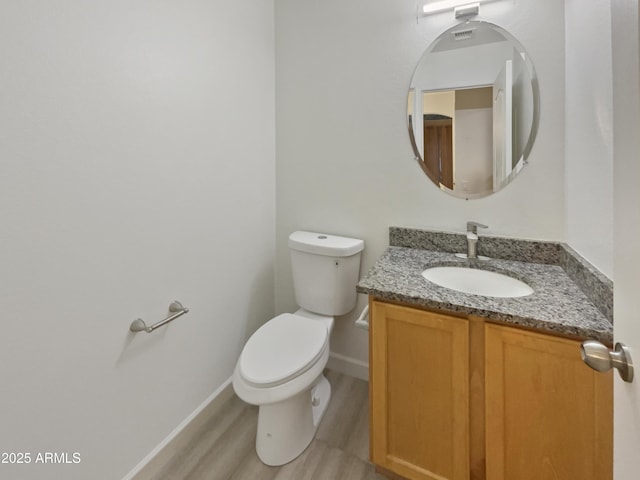 13033 W Avalon Dr, Avondale, AZ 85392 - bathroom with hardwood / wood-style flooring, vanity, and toilet