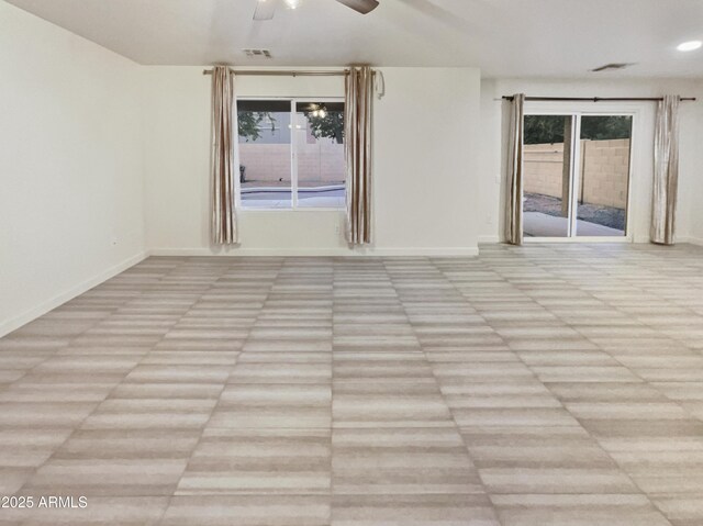 13033 W Avalon Dr, Avondale, AZ 85392 - empty room featuring ceiling fan