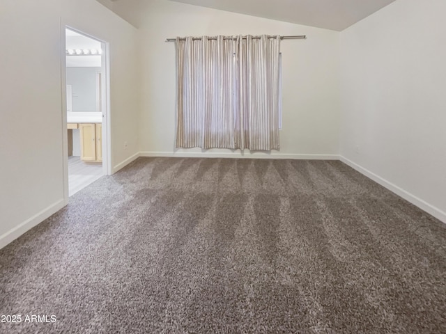 13033 W Avalon Dr, Avondale, AZ 85392 - empty room featuring carpet floors and vaulted ceiling