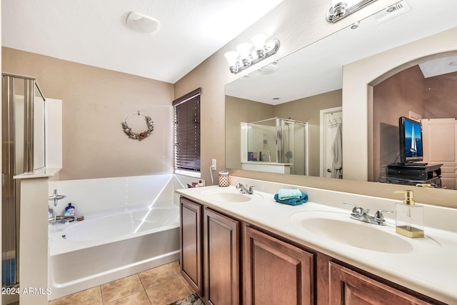 bathroom featuring tile patterned flooring, vanity, and plus walk in shower