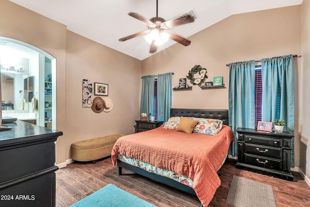 bedroom featuring connected bathroom, vaulted ceiling, dark hardwood / wood-style flooring, and ceiling fan