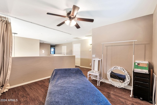 sitting room with ceiling fan and dark hardwood / wood-style flooring