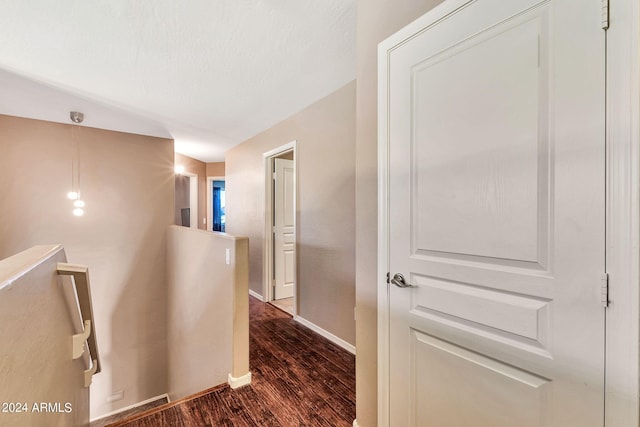 corridor featuring dark wood-type flooring