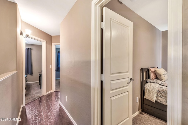 corridor with dark hardwood / wood-style floors