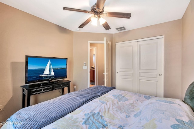 bedroom featuring ceiling fan and a closet