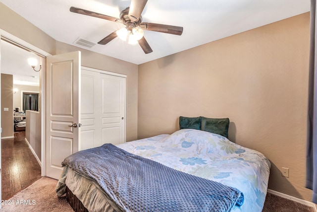 bedroom featuring a closet, ceiling fan, and hardwood / wood-style floors