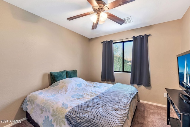 bedroom with ceiling fan and carpet floors