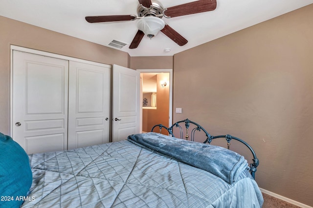 carpeted bedroom with a closet and ceiling fan