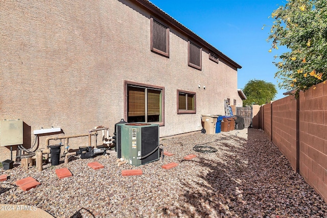 back of property with central air condition unit