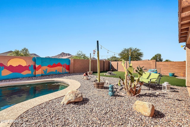 exterior space with a fenced in pool