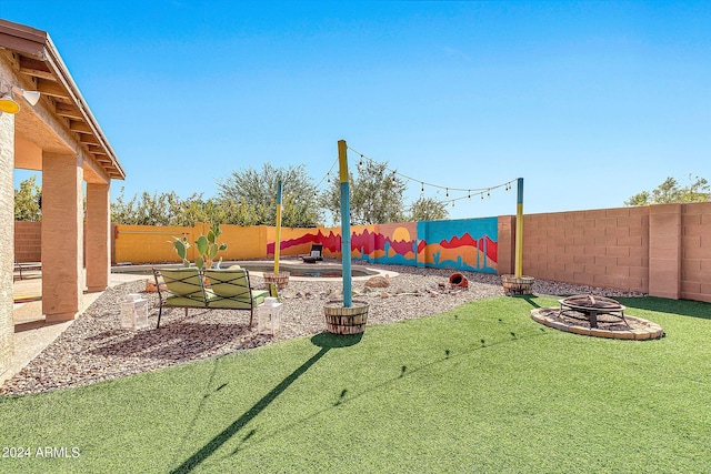 view of yard with a patio area and an outdoor fire pit