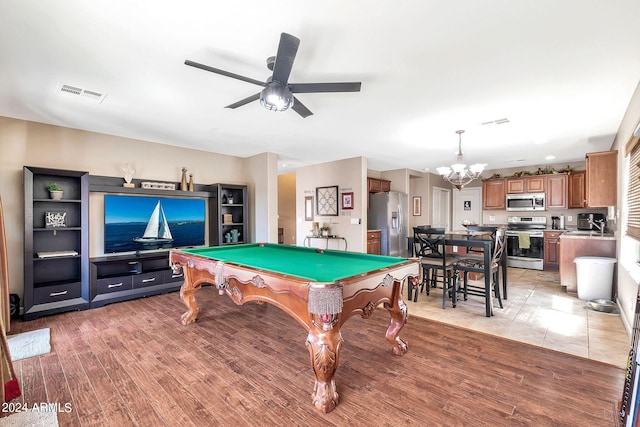 recreation room with ceiling fan with notable chandelier, light hardwood / wood-style floors, and billiards