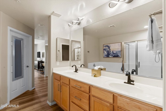19700 N 76th St Unit 1038, Scottsdale, AZ 85255 - full bath featuring double vanity, a shower stall, wood finished floors, and a garden tub