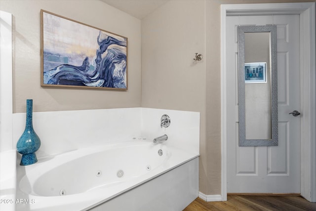 19700 N 76th St Unit 1038, Scottsdale, AZ 85255 - bathroom featuring wood finished floors and a jetted tub