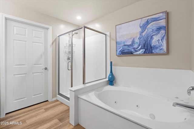 19700 N 76th St Unit 1038, Scottsdale, AZ 85255 - bathroom featuring a shower stall, a jetted tub, and wood finished floors