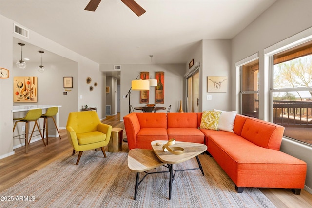 19700 N 76th St Unit 1038, Scottsdale, AZ 85255 - living area with wood finished floors and a ceiling fan