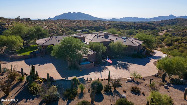 birds eye view of property with a mountain view