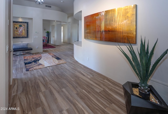 hall with hardwood / wood-style flooring