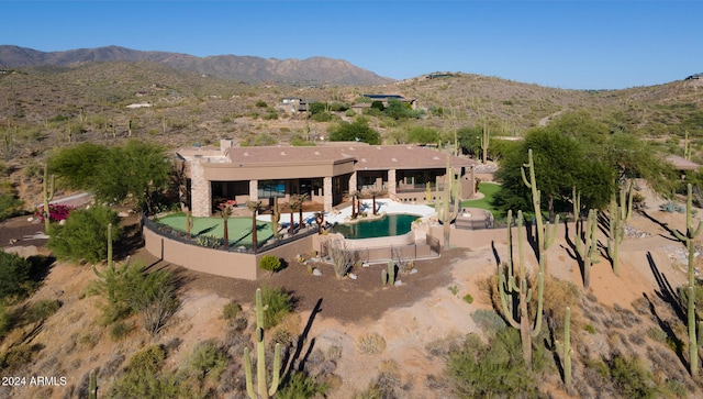 exterior space with a patio area and a mountain view