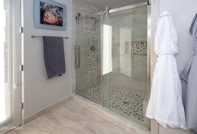 bathroom featuring an enclosed shower