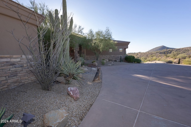 view of yard with a mountain view and a patio area