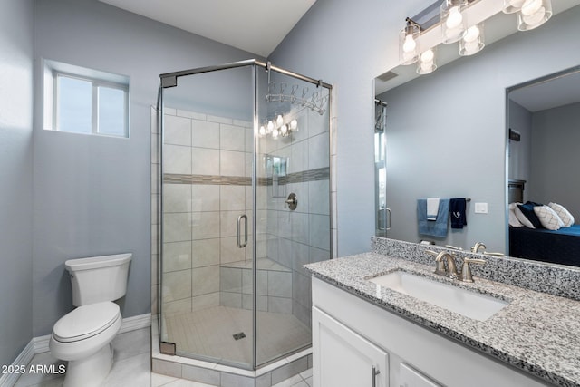 bathroom with tile patterned floors, toilet, a shower with door, and vanity