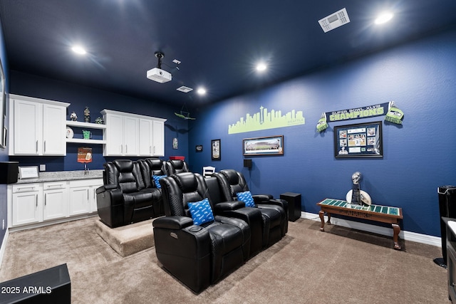 home theater room with light carpet