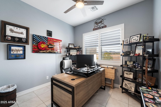 tiled home office featuring ceiling fan