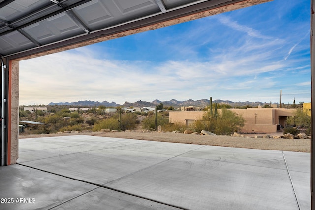 view of patio / terrace featuring a mountain view