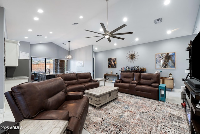 living room with light tile patterned floors, vaulted ceiling, and ceiling fan