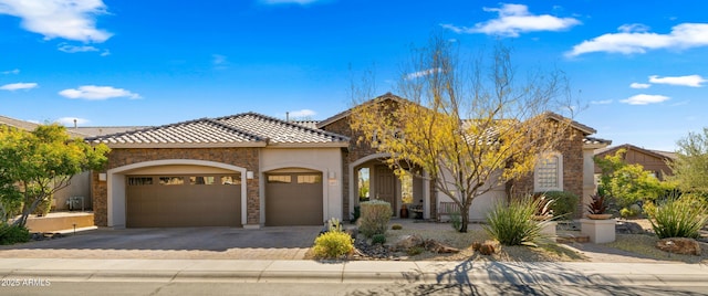 view of front of home with a garage