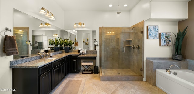 bathroom featuring vanity, tile patterned floors, and shower with separate bathtub