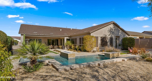 rear view of property with a patio