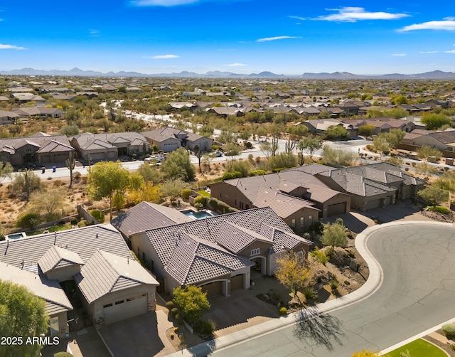 birds eye view of property featuring a mountain view