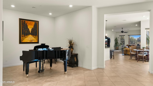 miscellaneous room featuring ceiling fan and light tile patterned flooring