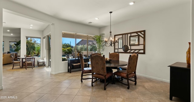 tiled dining space with an inviting chandelier