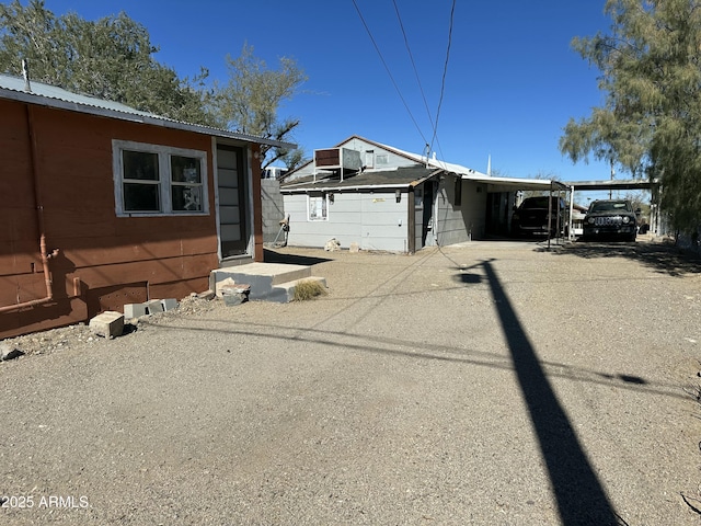 view of property exterior with a carport and central air condition unit